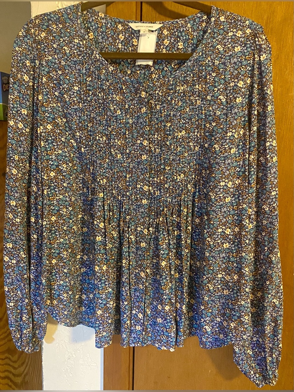 Lucky Brand floral peasant blouse featuring a rich blue color scheme